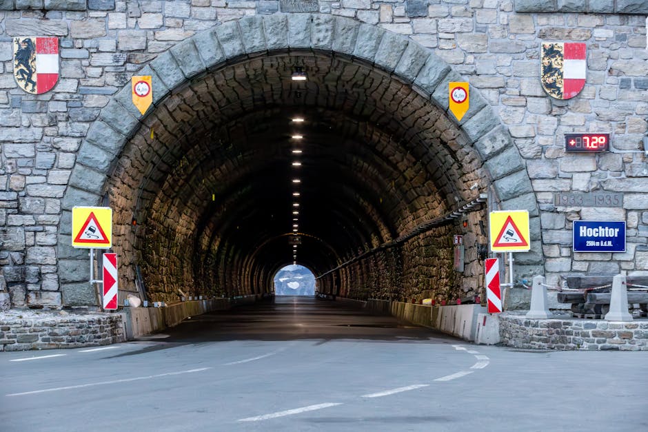 Captivating view of the Hochtor Tunnel entrance in Kärnten, Austria, framed by alpine stonework.